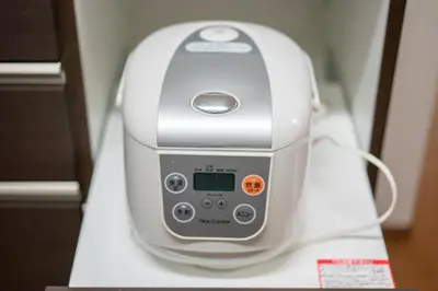 a white hair dryer sitting on top of a table at Yotsuya 110 in Tokyo