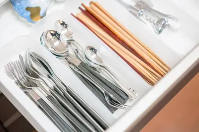 a white tray with silver utensils on a table at Yotsuya 110 in Tokyo