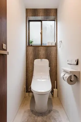 a white toilet in a bathroom with a window at Gracias Arakawa - Great Access to UENO & ASAKUSA area in Tokyo