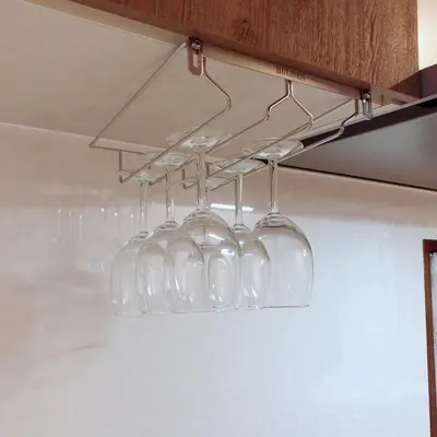 a bunch of wine glasses hanging from a rack at Central Field 5-6F in Tokyo