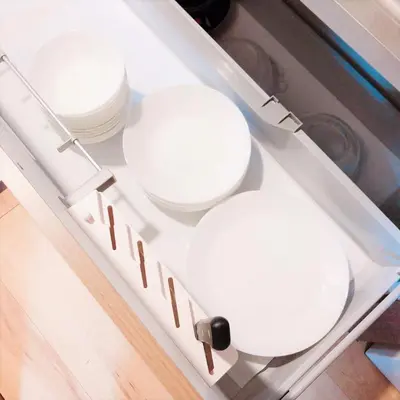 a drawer with three white toilet bowls in it at Central Field 5-6F in Tokyo