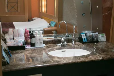 a bathroom counter with a sink in a hotel room at HOTEL D-WAVE Shinjuku\uff08Adult Only) in Tokyo