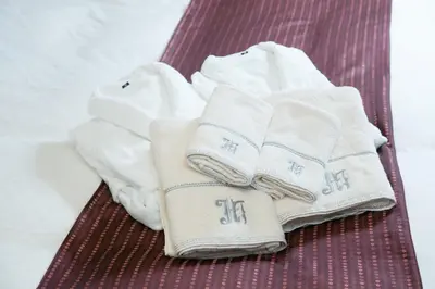 a pile of towels sitting on a red treadmill at HOTEL D-WAVE Shinjuku\uff08Adult Only) in Tokyo