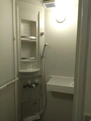 a bathroom with a shower and a sink and a light at \u4e0a\u91ce\u5fa1\u5f92\u753a\u79cb\u8449\u539f\u307e\u3067\u5f92\u6b69\u570f-JR\u5fa1\u5f92\u753a\u307e\u30673\u5206-Room\u30ed\u30fc\u30bc201 in Tokyo