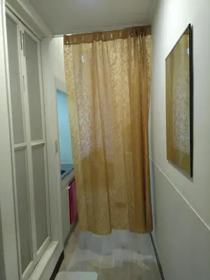 a shower curtain in a room with a window at \u4e0a\u91ce\u5fa1\u5f92\u753a\u79cb\u8449\u539f\u307e\u3067\u5f92\u6b69\u570f-JR\u5fa1\u5f92\u753a\u307e\u30673\u5206-Room\u30ed\u30fc\u30bc201 in Tokyo