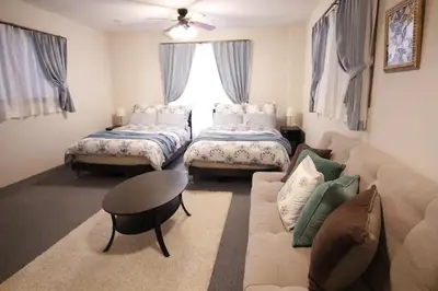a living room with two beds and a couch at Central Field 4F in Tokyo
