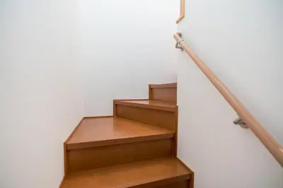 a stairwell with wooden steps and a railing at Shinjuku-ku - House / Vacation STAY 3185 in Tokyo