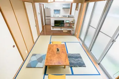 a room with a table and chairs and windows at Shinjuku-ku - House / Vacation STAY 3185 in Tokyo