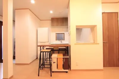 a small kitchen with a desk with a computer on it at NY Stage \u65b0\u5bbf in Tokyo
