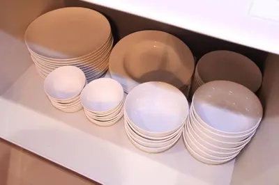 a group of plates and bowls in a drawer at NY Stage \u65b0\u5bbf in Tokyo