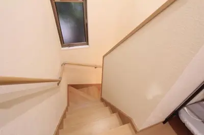 a staircase in a house with a window at NY Stage \u65b0\u5bbf in Tokyo