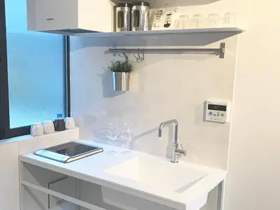 a kitchen with a sink and a window at Oku-Shibu Residence in Tokyo