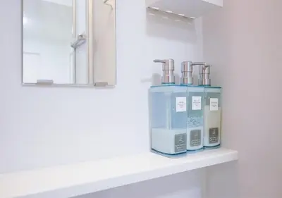 a machine sitting on a shelf in a bathroom at ZAITO Tokyo Kikukawa Economy Inn \u5b85\u4e1c\u4e1c\u4eac\u83ca\u5ddd\u6c11\u5bbf in Tokyo