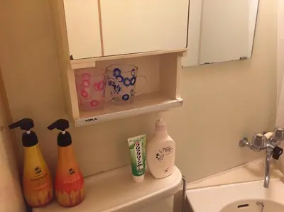 a bathroom with a sink and some bottles on a counter at Tokyo Stay Rord Shinjuku in Tokyo