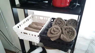 two baskets of towels on a table at Tokyo Stay Rord Shinjuku in Tokyo