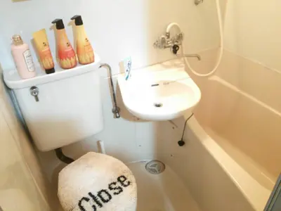 a small bathroom with a sink and a toilet at Tokyo Stay Rord Shinjuku in Tokyo
