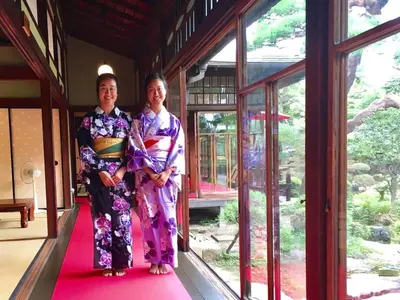 two women in kimonos are standing in a doorway at Ys Bed & Kitchen Tokyo #HY1 in Tokyo