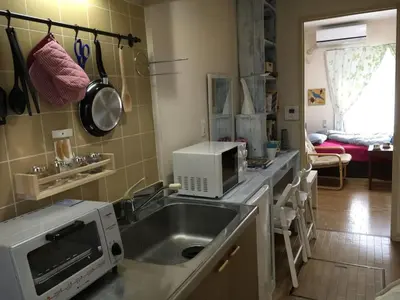a kitchen with a sink and a microwave at Ys Bed & Kitchen Tokyo #HY1 in Tokyo