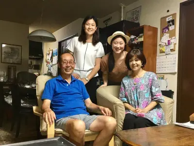 a group of people sitting in a living room at Ys Bed & Kitchen Tokyo #HY1 in Tokyo