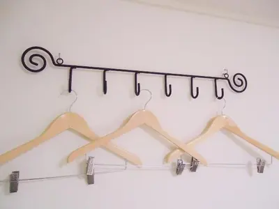 a group of hangers hanging from a rack at Shin-Okubo City Hotel in Tokyo