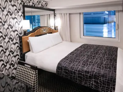 a hotel room with a bed and a window at APA Hotel Shinjuku Kabukicho Chuo in Tokyo