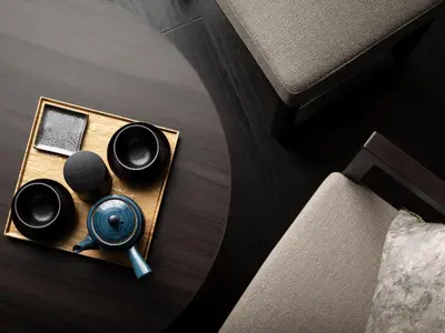 a table with a tray with two cups and a mirror at Mitsui Garden Hotel Ginza-gochome in Tokyo