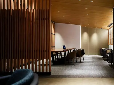 a conference room with a wooden table and chairs at Mitsui Garden Hotel Ginza-gochome in Tokyo