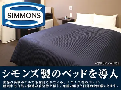 a sign for a hotel room with a bed at HOTEL LiVEMAX Tokyo Shintomicho in Tokyo