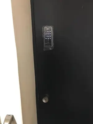 a black elevator with a button on the side at 2F female and lover of man and woman only room in Ueno in Tokyo