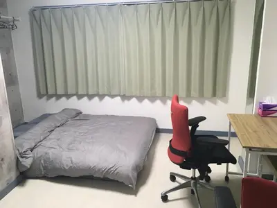 a bedroom with a bed and a desk and a chair at 2F female and lover of man and woman only room in Ueno in Tokyo