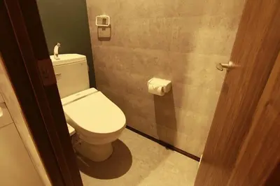 a bathroom with a white toilet in a stall at Shinjuku NY House 1 in Tokyo