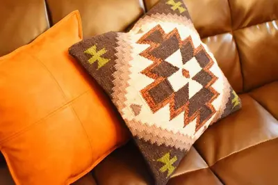 two pillows sitting on top of a leather couch at Prime Stage Otsuka Ikebukuro P203 in Tokyo