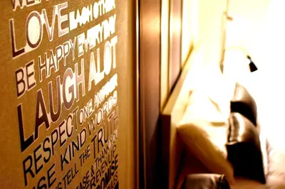 a bedroom with a sign on the wall next to a bed at Prime Stage Otsuka/Ikebukuro P201 in Tokyo