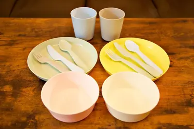 a table with plates and cutlery on them at Prime Stage Otsuka/Ikebukuro P201 in Tokyo