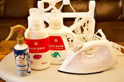a table with bottles of cleaner and a phone at Prime Stage Otsuka/Ikebukuro P201 in Tokyo