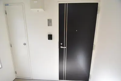 a black door in a room with white walls at Prime Stage Otsuka/Ikebukuro P201 in Tokyo