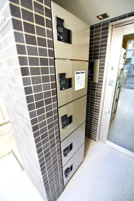 a bathroom with a brick wall with drawers at Prime Stage Otsuka/Ikebukuro P201 in Tokyo