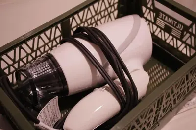 a wire basket with hair dryers and a hair drier at ACT Residence No.1 201 in Tokyo