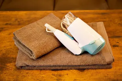 a blue and white toothbrush sitting on top of a towel at Prime Stage Otsuka/Ikebukuro P204 in Tokyo