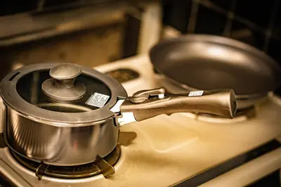 a metal pot sitting on top of a stove at Hotel Atelier Tokyo in Tokyo