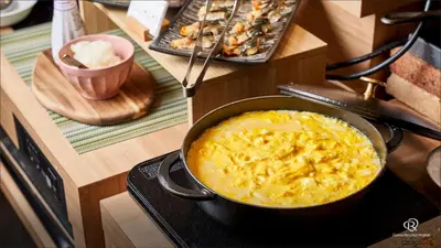 a pot of macaroni and cheese on a stove at Daiwa Roynet Hotel Shimbashi in Tokyo