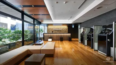 a living room with a couch and a table at Daiwa Roynet Hotel Shimbashi in Tokyo
