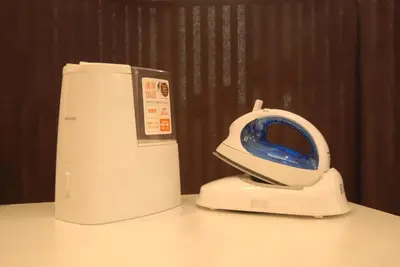 a white machine sitting on top of a table at Okachimachi Urban Hotel in Tokyo
