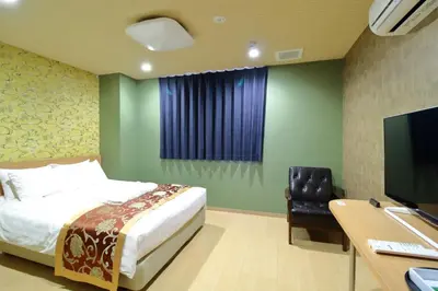 a bedroom with a bed and a desk with a computer at Arakawa-ku - Hotel / Vacation STAY 21942 in Tokyo
