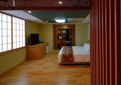 a bedroom with a bed and a television in it at Arakawa-ku - Hotel / Vacation STAY 21933 in Tokyo