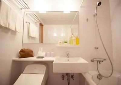 a bathroom with a sink and a toilet and a mirror at Arakawa-ku - Hotel / Vacation STAY 21943 in Tokyo