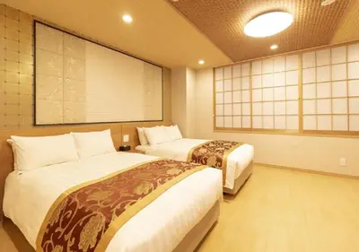 a room with two beds and a large screen at Arakawa-ku - Hotel / Vacation STAY 22245 in Tokyo