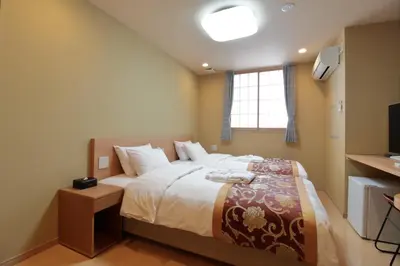 a bedroom with a large bed and a window at Arakawa-ku - Hotel / Vacation STAY 22248 in Tokyo