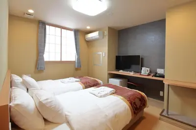a hotel room with two beds and a desk at Arakawa-ku - Hotel / Vacation STAY 22248 in Tokyo