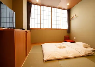 a bedroom with a white bed in front of a window at Arakawa-ku - Hotel / Vacation STAY 21946 in Tokyo